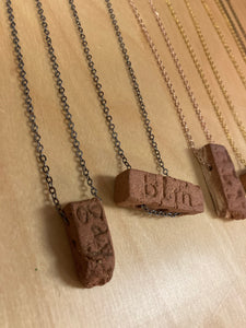 RIOT brick pendants